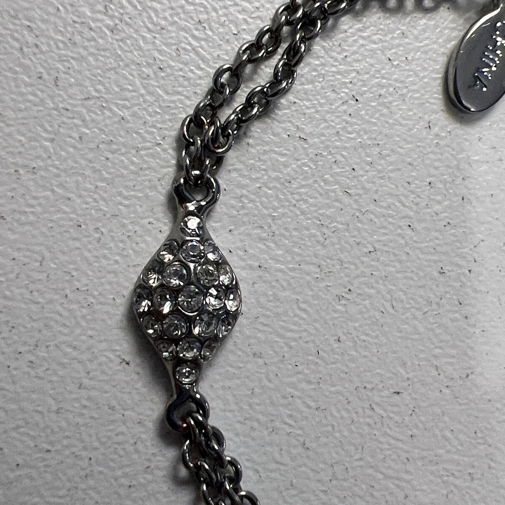 JTV JOAN BOYCE, GUNMETAL TONE
WITH WHITE CRYSTAL EVIL EYE
STATION BRACELET - Picture 4 of 7